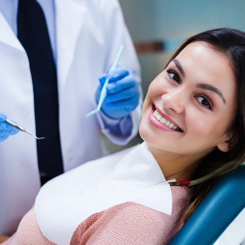 Woman smiling at endodontic office