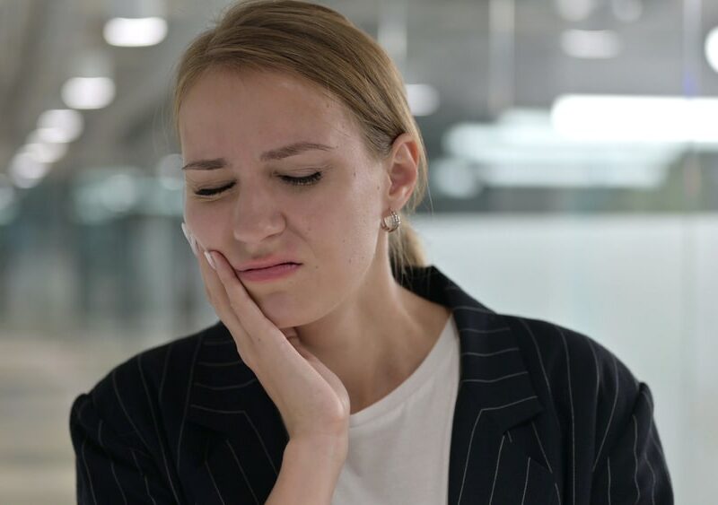 Sick Young Businesswoman having Toothache, Cavity
