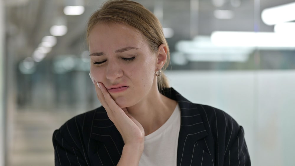 Sick Young Businesswoman having Toothache, Cavity